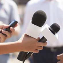 news reporter holding a microphone